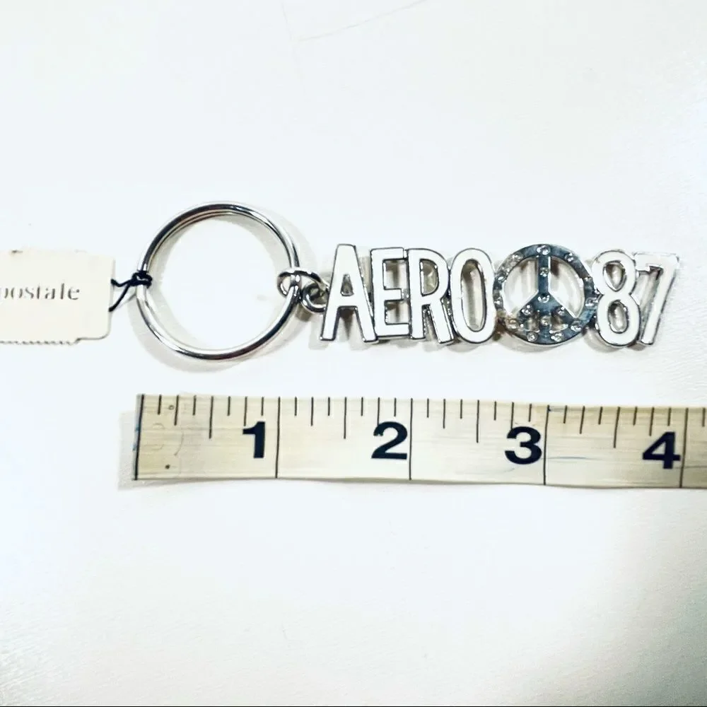 NWT Aeropostale Metallic Peace Sign White Keychain